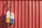 Fishing buoys on red wooden wall, horizontal