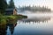 fishing cabin by a misty lake during early morning light