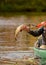 Fishing in a canoe for a pike fish