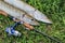 Fishing catch pike on grass and fishing gear