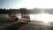 Fishing chairs standing at fishing pier on background morning fog over water