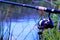 Fishing-entertainment, recreation and sports in nature. Spinning-sports tackle for catching fish on a water background, convenient