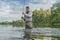 Fishing. Fisherman catch fish in water at river on blurred background with splashing and drops