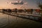 Fishing houses, holiday home, wooden house in the lake with jetty. Bokod Hungary Bora Bora landscape with sunset