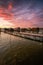 Fishing houses, holiday home, wooden house in the lake with jetty. Bokod Hungary Bora Bora landscape with sunset