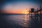 A fishing hut called carrelet with craft lifting net at sunset. Esnandes, charente maritime, France. The sun is caught in the net