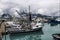 Fishing industrial trawler ships parked in marina pier in Valdez, Alaska.