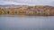 Fishing lake with picnic shelters at foothills of Colorado