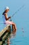 Fishing - lovely girl fishing on the pier