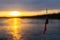 Fishing lure on line above the Naknek River in Alaska during sunrise