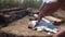 Fishing. Man angler cleaning preparing fish on the