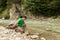 Fishing on mountain river in summer