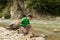 Fishing on mountain river in summer