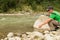 Fishing on mountain river in summer