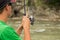 Fishing on mountain river in summer