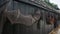 A fishing net dries against a black tarred fence at the Open Air Museum in Enkhuizen, the Netherlands