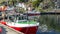 Fishing nets, colorful buoys on the quay of the Norwegian marina