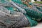 Fishing Nets Tangled Together In Messy Pile In Shipyard
