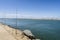 Fishing from the pier on Atlantic Ocean in Isla Canela in Andalusia, Spain