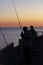 Fishing at the pier during sunset, Cedar Key, USA