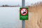 Fishing prohibited sign near lake - NO FISHING