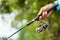 Fishing reel and rod in fisherman hand in a pond