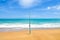 Fishing rod on empty beach with beautiful ocean. rod spinning with spoon-bait at the beach fishing rod on a beach against a