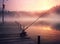 Fishing rod, spinning reel on the background pier river bank. Sunrise. Fog against the backdrop of lake. Misty morning