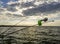 Fishing rods in front of a beautiful horizon. Roar - the sun sets. Fishing at sunset. A bluebell for fishing rods on the