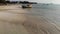 Fishing ship on sand coast near water. Old deserted rusty fishing boat on sand shore near sea in sunny day, koh Samui