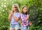 Fishing skills. Summer hobby. Happy smiling children with net and rod. Happy childhood. Adorable girls nature background