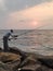 Fishing in the sunset of India