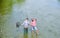 Fishing team. Happy fisherman with fishing rod and net. Hobby and sport activity. Male friendship. Father and son