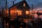 fishing trawlers cabin lights glowing against the dusk backdrop