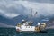 Fishing vessel sails into a storm in the Westfjords in Iceland