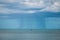 Fishing vessel under storm with big waves in storm and raining