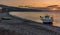 Fishing vessels moored off the beach of Castell de Ferro, Spain at sunrise