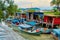 Fishing village in Asia. The boats are on land near the river