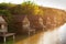 Fishing wooden lakeside houses at sunset