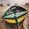 Fishingboat on the beach. Artistic look in vintage vivid colours.