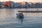 Fishman on boat at early sunrise in Loutraki