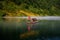 A fishman cast a golden net  on the river