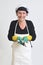 Fishmonger holding a pile of sardine on white