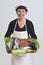 fishmonger showing a plate with fish and seafood on white background