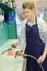 Fishmongers employee cleaning kitchen