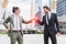 Fist bump or Knuckle bump between two businessmen agreement at outdoor in the city, Business cooperation and participation concept