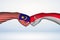 Fist bump of Malaysian and Singaporean flags. Two hands with painted flags of Malaysia and Singapore Flag fist bumping as a symbol