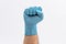 Fist Hand in medical blue latex protective glove on white background