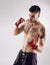 Fist, MMA and wraps for male fighter or boxer, pose and boxing on white background. Fitness, hands and athlete for