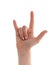 Fist with raised index finger and little finger on white background